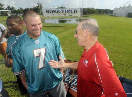 Owner Ross visits with QB Chad Henne