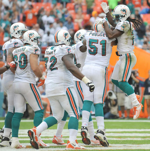 D. Bess celebrates with teammates--FINS WIN 3rd STRAIGHT!!!