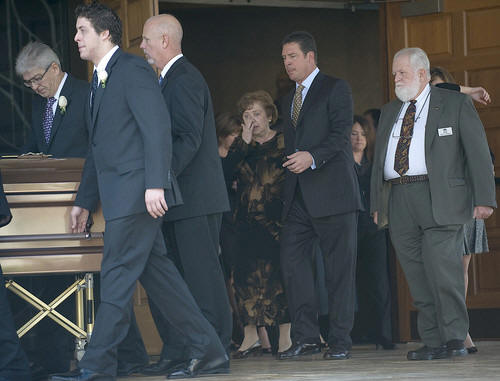 Dolphins Hall of Fame quarterback Dan Marino escorts his mother, Veronica Marino, out of St. Bonaventure Catholic Church as they follow his father's, Daniel C. Marino Sr. 71, casket after his funeral ceremony at the Davie Church. Marino, 71, died of cancer on December 6, 2008.
